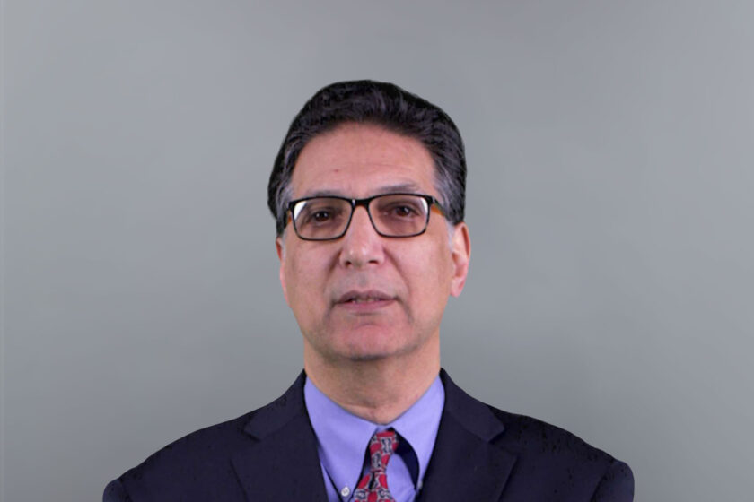 Professional headshot of John Oppenheimer